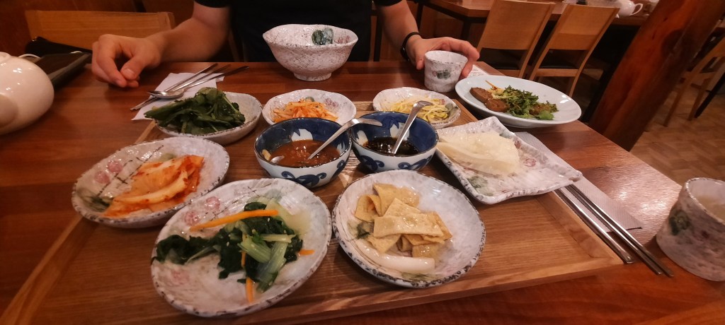 This image has an empty alt attribute; its file name is banchan-fish-cakes-cabbage-roots.jpg